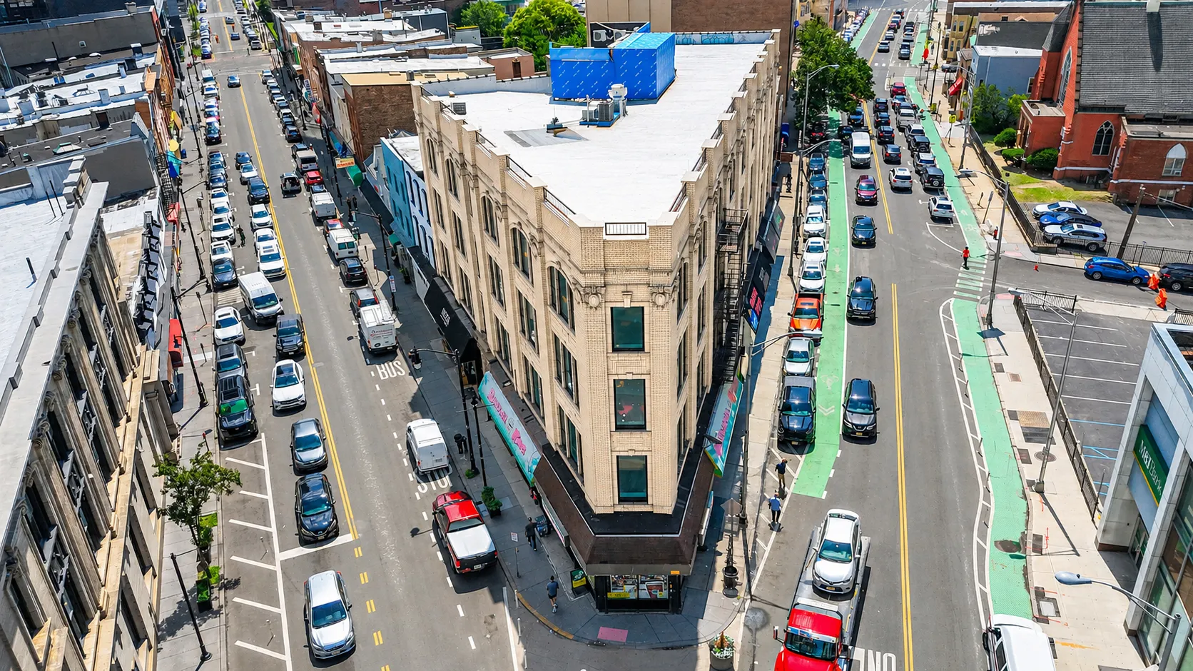 Aerial view looking down at the wedge-shaped corner where two avenues meet